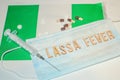 Nigerian flag under words Lassa fever outbreak concept. protective breathing mask and syringe. Lassa hemorrhagic fever LHF endemic