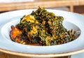 Nigerian Food: Delicious Efo riro soup on white plate