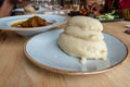 Nigerian Food: Delicious Pounded Yam with Banga Soup in background for dining concept Royalty Free Stock Photo