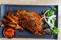 Nigerian Food: Delicious Roasted fish and fried plantain Royalty Free Stock Photo