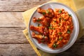 Nigerian food party: Jollof rice with fried chicken wings close-up. Horizontal top view