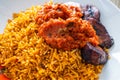 nigerian Jollof Rice served with plantain and stew