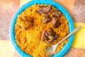 Nigerian Jollof Rice Servied with fried meat