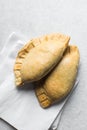 Nigerian meat pie on a marble tray, freshly baked nigerian meat pie