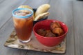 Nigerian Puff Puff and meatpie snacks served with iced tea