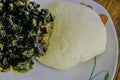 Nigerian Ponded yam served with Afang Soup