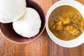 Nigerian Pounded yam wrapped in plastic served with Banga Soup