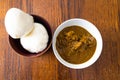 Nigerian Pounded yam wrapped in plastic served with Banga Soup