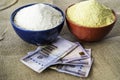 Nigerian yellow and white Garri in Bowls at marketplace