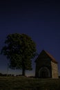 Night abandoned chapel under the stars in the night sky