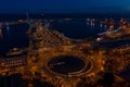 Night aerial photo of port vellof Barcelona and road with car traffic