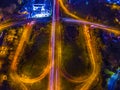 Night aerial shot of a city with lights and traffic