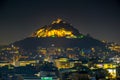 Night aerial view of lycabetus hill and its neighborhood in athens...IMAGE