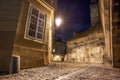 Night Alley in Prague Near Charles Bridge, Illuminated by a Street Lamp Royalty Free Stock Photo