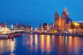 Night Amsterdam canal and Basilica Saint Nicholas Royalty Free Stock Photo