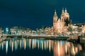 Night Amsterdam canal and Basilica Saint Nicholas Royalty Free Stock Photo