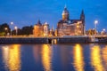 Night Amsterdam canal and Basilica Saint Nicholas Royalty Free Stock Photo