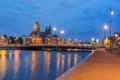 Night Amsterdam canal and Basilica Saint Nicholas Royalty Free Stock Photo