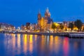 Night Amsterdam canal and Basilica Saint Nicholas Royalty Free Stock Photo