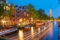 Night Amsterdam canal and Westerkerk church Royalty Free Stock Photo