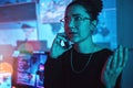 Night, angry and a woman hacker on a phone call during a cyber security emergency in her office. Communication, software Royalty Free Stock Photo