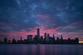 Night atmosphere with red pre-sunrise clouds above Lower Manhattan cityscape