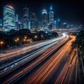 Night autobahn lights from cars against the city