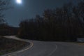 Night Autumn forest under the moonlit and starry sky