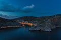 Night Balaclava town. Panorama of the night town with a small illumination of the building on the shore of the sea bay near the Royalty Free Stock Photo