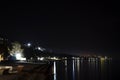 Night beach of pebbles Abkhazia Gagra. Night city in the reflection of the water of the sea. Highlands, tourism, travel, night Royalty Free Stock Photo