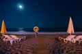 Night Beach, sand and sea views, umbrellas and sun loungers. Lifebuoy. Moon light. No body. coast and embankment Turkey Alanya Royalty Free Stock Photo