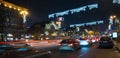 Night in the big city, the cars traveling on the highway and shines a blinding light. City, Kiev - december, 2017 Cristmas Royalty Free Stock Photo