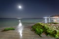 Night Black sea landscape in Odessa with moon reflection and colored stones Royalty Free Stock Photo