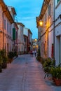 Night or blue hour view of a narrow street in the old town of Alcudia, Mallorca, Spain Royalty Free Stock Photo