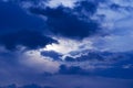 Night blue sky and moonlight background. The magic moon shines in the night sky through dark blue clouds Royalty Free Stock Photo