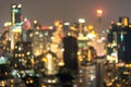 Night blurred bokeh lights of illuminated modern Bangkok city in dusk Royalty Free Stock Photo
