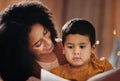 Night, book and mother with child in bedroom for bedtime storytelling, fairytale and education. Reading, happiness and Royalty Free Stock Photo