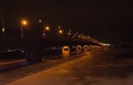 Night bridge across the river night lights winter and frozen river Royalty Free Stock Photo