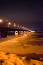 Night bridge across the river night lights winter and frozen river Royalty Free Stock Photo