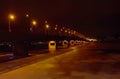 Night bridge across the river night lights winter and frozen river Royalty Free Stock Photo