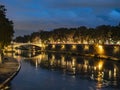 Night on bridge Garibaldi and the Fiume Tevere river in Rome Italy Royalty Free Stock Photo