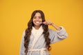 Night brushing teeth. Dental care, hygiene and child. Teenage girl with toothbrush brushing teeth. Royalty Free Stock Photo