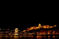 Night Budapest, glowing in gold. The bridge chain over the Danube is illuminated by light bulbs. photo from the river