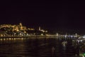 Night Budapest at the river Danube. Buda Castle Royal Palace and Chain bridge Szechenyi lanchid on background. Hungary Royalty Free Stock Photo