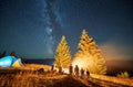 Night camping in mountains under starry sky with Milky way. Royalty Free Stock Photo