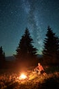 Night camping in mountains under starry sky with Milky way.