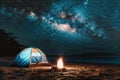 Night camping under the stars with tent and campfire on the beach Royalty Free Stock Photo