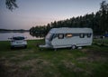 Night campsite camping caravan by lake Ragnerudssjoen in Dalsland Sweden beautiful nature forest pinetree Royalty Free Stock Photo