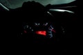 Night car driving. Hands on wheel, dashboard