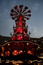 Night Christmas lights of traditional wooden carousel of nativity scenes in Berlin Germany. Fairy tale lighted Christmas pyramid Royalty Free Stock Photo